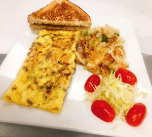 An omelet and a sandwich on a plate.