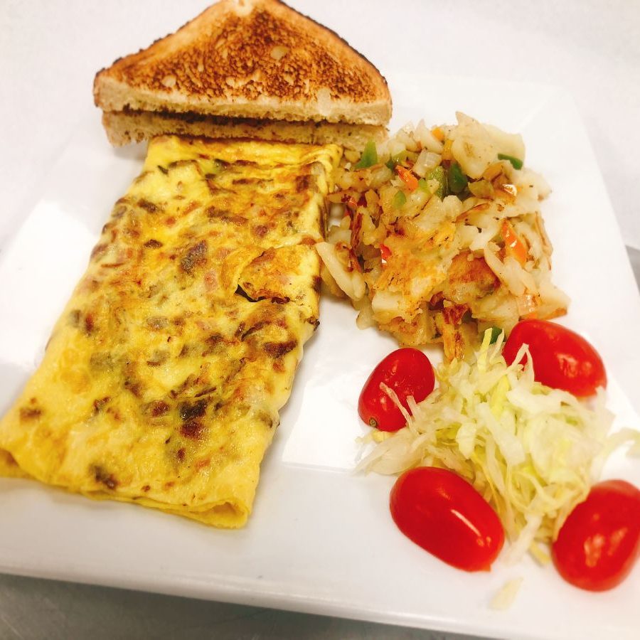 An omelet and a sandwich on a plate.